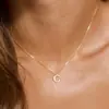 Europa y Estados Unidos venta transfronteriza exquisito collar personalizado de 26 letras moda mujer simple colgante de cobre joyería transfronteriza venta al por mayor