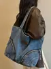 Bolso de mezclilla de gran capacidad, nuevo bolso de mano casual para el verano 2026, bolso tote de estilo relajado para mujer