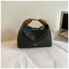 Bolso de mano pequeño versátil para uso diario para mujer 2026 nuevo diseño de nicho elegante bolso tipo empanada tacto de alta gama bolso de un solo hombro bandolera