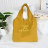 Nova Bolsa Tote Bordada com Letras de Grande Capacidade Mochila de Nylon Simples Versátil Moda de Nicho Pequeno Bolsa de Ombro Único