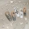 Liga transfronteiriça 26 letras em inglês joias para nail art metal estéreo diy broca mista para unhas acessórios de decoração atacado