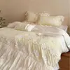 Estilo romántico francés femenino Tencel de algodón ultra suave con volantes y encaje color crema juego de ropa de cama casual de cuatro piezas
