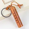 Colgantes de llavero para coche de madera de durazno al por mayor para fabricantes con escrituras budistas, el Mantra Shurangama, sutras auspiciosos y amuletos de la fortuna, disponibles para vendedores ambulantes