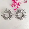Europa y Estados Unidos transfronterizos industria pesada textura hueca aretes de girasol ZA simples elegantes geométricos aleación flor aretes de temperamento