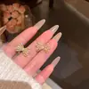 Brincos de Laço Doces e Elegantes Estilo Coreano para Mulheres, Luxo Leve Nicho Exquisitos Micro-Incustados Zircônia Pérola Brincos de Tarraxa Atacado