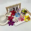 Venta al por mayor de fábrica Venta caliente transfronteriza Flores artificiales Orquídeas tailandesas Sombreros de flores Zapatos con flores Tocados festivos Flores para la cabeza Flores falsas