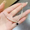 Collar Fragmento de Plata Flor de Cuatro Hojas Zircón Negro Perla con Diseño de Alta Gama, Gargantilla de Celebridad de Internet de Moda, Cadena Versátil de Nicho para Clavícula