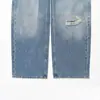 Venta al por mayor transfronteriza Primavera 2026 Moda europea y americana Versátil Casual Diseño desgastado Dobladillo enrollado Jeans para mujer E490469