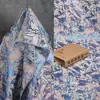 Tela jacquard metálica azul con diseño de plantas y flores para vestidos, ropa y materiales decorativos de diseñador