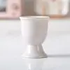 Taza creativa para el desayuno de Pascua taza de cerámica de alta gama huevo sobre la mesa portahuevos portahuevos