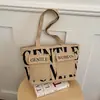 Bolso de hombro para mujer de gran capacidad, bolso tote casual para salidas, bolso de axila versátil con estampado de letras de moda, bolso de nicho y versátil