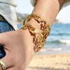 Estilo de Nicho Europeo y Americano Acero Inoxidable Hueco Chapado en Oro de 18K Estilo de Viaje Festivo Lujo Ligero Moda Pulsera Abierta para Mujer