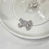 Clip para oreja de flor de zircón con lazo, clip para cartílago de la oreja sin perforación, accesorio de oreja ultra de hada, diseño único, joyería de estilo minimalista para mujer