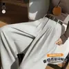 Foto real de traje de mujer de alta gama con caída, pantalones de pierna ancha para otoño 2026, con cinturón, cintura alta, plisados, adelgazantes, de pierna recta, hasta el suelo