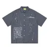 Savagebase Camisa de Manga Corta con Estampado de Letras Estilo Graffiti Callejero Americano Verano Casual Camisa a Cuadros de Algodón