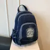Mochila de grande capacidade, modelo novo 2026, transfronteiriça, casual e estilosa para o dia a dia, bolsa transversal de ombro único em jeans, simples e moderna.