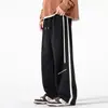 Pantalones casuales para hombre, pantalones deportivos holgados de moda de primavera y otoño, pantalones rectos cálidos con forro polar para otoño e invierno, pantalones deportivos de dos usos para hombre.