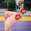 Broche de ciruela estilo chino nuevo, pin decorativo para escote de abrigo de otoño e invierno, temperamento retro, broche rojo ciruela