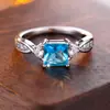 Anillo de Princesa Azul Piedra Europea y Americana Rongxing Transfronterizo, Anillo de Banda Retorcida con Pequeñas Piedras Incrustadas en Ambos Extremos, Anillo Versátil