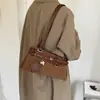 Bolso de axila de nicho de alta gama para mujer, nuevo modelo otoño e invierno 2026, gran capacidad, versátil para ir al trabajo, bolso de hombro y bolso de mano tipo baguette