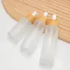 Botella de vidrio transparente para aceites esenciales con tapa de bambú, gotero con punta de goma, botella de aceite esencial para masajes, varios tamaños de botellas dispensadoras de sérum