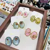 Pendientes Ovalados Elegantes de Gama Alta Estilo Francés Retro con Flores Secas y Goteo de Aceite