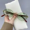 Gafas de Sol con Patas de Madera y Montura Ovalada 2025 Nueva Moda Popular Europea y Americana Street Style Fotografía Callejera Gafas de Sol Anti-UV Tendencia