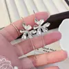 Pendientes Vintage de Flor de Lirio 2026 Modelo Nuevo Ganchos de Oreja de Lujo Ligero de Alta Gama para Mujer Pendientes de Nicho de Estilo Antiguo para Mujer