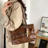 Bolso tote retro de moda transfronterizo para mujer 2026 Otoño nuevo bolso de hombro único con empalme de color liso bolso para el hombro para el trabajo