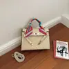 Bolso nuevo Kelly para mujer de gran capacidad, bolso de mano de moda con pañuelo de seda, elegante y versátil para el trabajo, bolso de hombro y cruzado