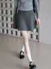 Falda corta de punto acampanada con cintura elástica gris oscuro para mujer, nuevo estilo otoño 2026, falda midi de lana holgada y versátil