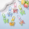 Llavero colgante de resina de color caramelo simulación de mariposa DIY accesorio de llave con cuentas de dibujos animados decoración creativa para bolsa