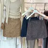Falda midi de mezcla de lana gris para mujer otoño/invierno 2026, falda corta nueva de cintura alta, falda de invierno súper elegante para combinar con un abrigo