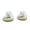 Fiebre de estilo navideño y de Año Nuevo con pendientes de amor plateados tridimensionales, pendientes de clip para orejas con forma de corazón de melocotón, simples y de alta gama, para mujer