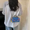 Bolso pequeño ligero y versátil de tela de nailon para mujer, nuevo bolso cruzado casual 2026, bolso para teléfono móvil exquisito y súper popular, bolso de mano pequeño