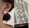 Pó para Pão Chinês no Vapor Shijia Brilhante Leite Branco Pérola Brilhante Brincos para Mulheres Agulha de Prata Esterlina S925 Nicho High-End Versátil Novos Brincos
