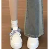 Tênis brancos da moda para mulheres 2026 novo modelo ins moda sola grossa aumento de altura estilo universitário versátil casual calçados esportivos