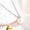 Versátil Nuevo Pequeño Forma de Bombilla Cuatro Puntas 2026 Estilo Vintage Lujo Ligero Fuerte Brillo Collar Redondo de Perlas para Mujeres
