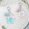 Dulce, Fresco y Versátil Estilo Pareja Bolas de Pelo Multicolor Ojo de Gato Perlas Estrella Acrílico Lazo Llavero Colgante para Bolso