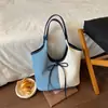 Bolsa de mão casual com laço estilo coreano transfronteiriça 2026 nova cor vintage color-blocking grande capacidade ombro bolsa saco de compras