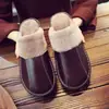 Pantuflas de piel de vaca Haining para hombre y mujer otoño e invierno amantes antideslizantes hogar interior suelo cálido cuero algodón pantuflas al por mayor