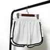 Shorts casuais finos de verão calças de corrida de três pontos femininas versão coreana de calças esportivas largas hot pants calças de praia atacado barato