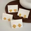 Pendientes de Lujo Ligero, Lindos y con Corazón Cuidadoso para Mujer, Serie Hueca Versátil de Nicho Colección de Pendientes Dorados de Gama Alta