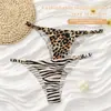 Pantaletas sin costuras en forma de T estilo europeo y americano personalizadas, Braguitas sexys de tiras finas para mujer, Pantaletas invisibles transpirables de una sola pieza con estampado de leopardo