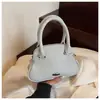 Bolsas Transfronteiriças 2025 Primavera e Verão Novo Nicho Doce e Fofo Bolsa de Concha Bolsa de Ombro Fashion Bolsa de Bowling Portátil