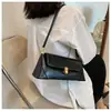 Bolso de Axila con Textura Retro de Alta Calidad para Mujer 2026 Nuevo Bolso Francés de Nicho de Hombro Único Bolso Baguette Versátil y Moderno