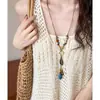 Collar de cerámica tejido a mano inspirado en el Zen con plumas de bronce antiguo, cadena larga para suéter estilo étnico vintage bohemio