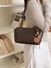 Bolso de mano casual de estilo coreano transfronterizo para mujer, nuevo modelo 2026, alta calidad, elegante, versátil, bolso de hombro para debajo del brazo