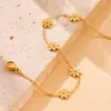 Europa y Estados Unidos moda transfronteriza todo a juego alta calidad superficie fotosensible acero inoxidable chapado en oro flor de margarita pendientes de botón pulsera collar traje
