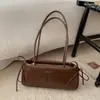 Bolsa Pequena Retro Texturizada de Luxo para Mulheres 2025 Novo Modelo Versátil Bolsa de Ombro para o Dia a Dia Bolsa de Mão Fashion Bolsa Baguette